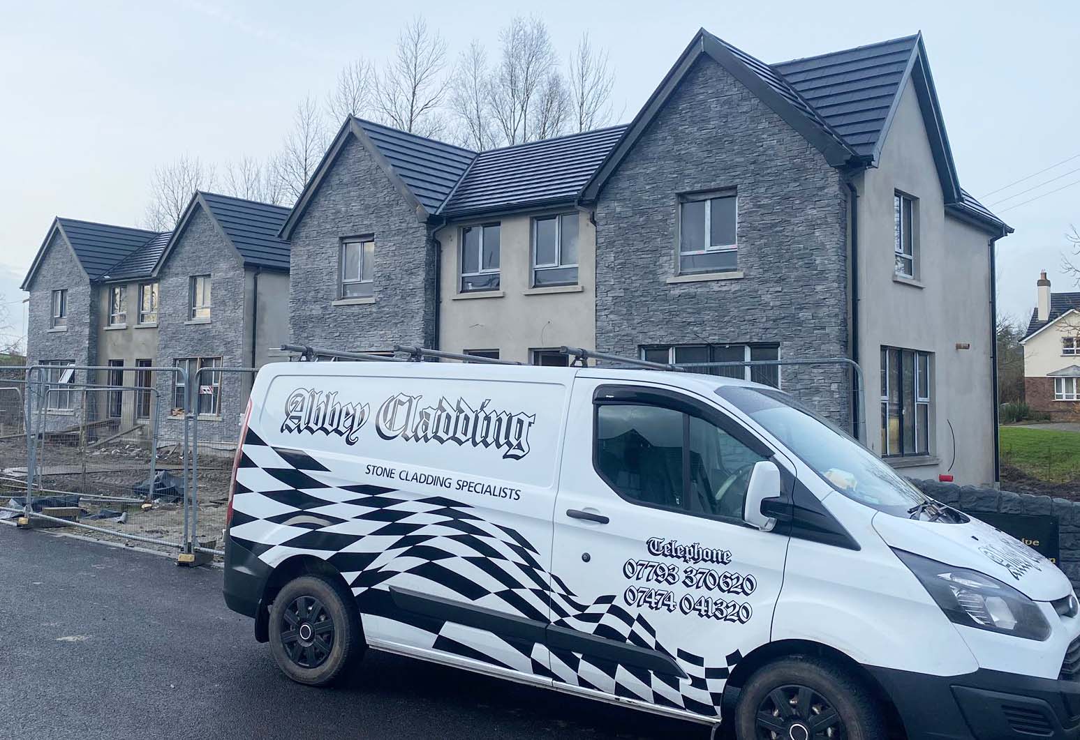 Abbey Cladding Van outside new houses